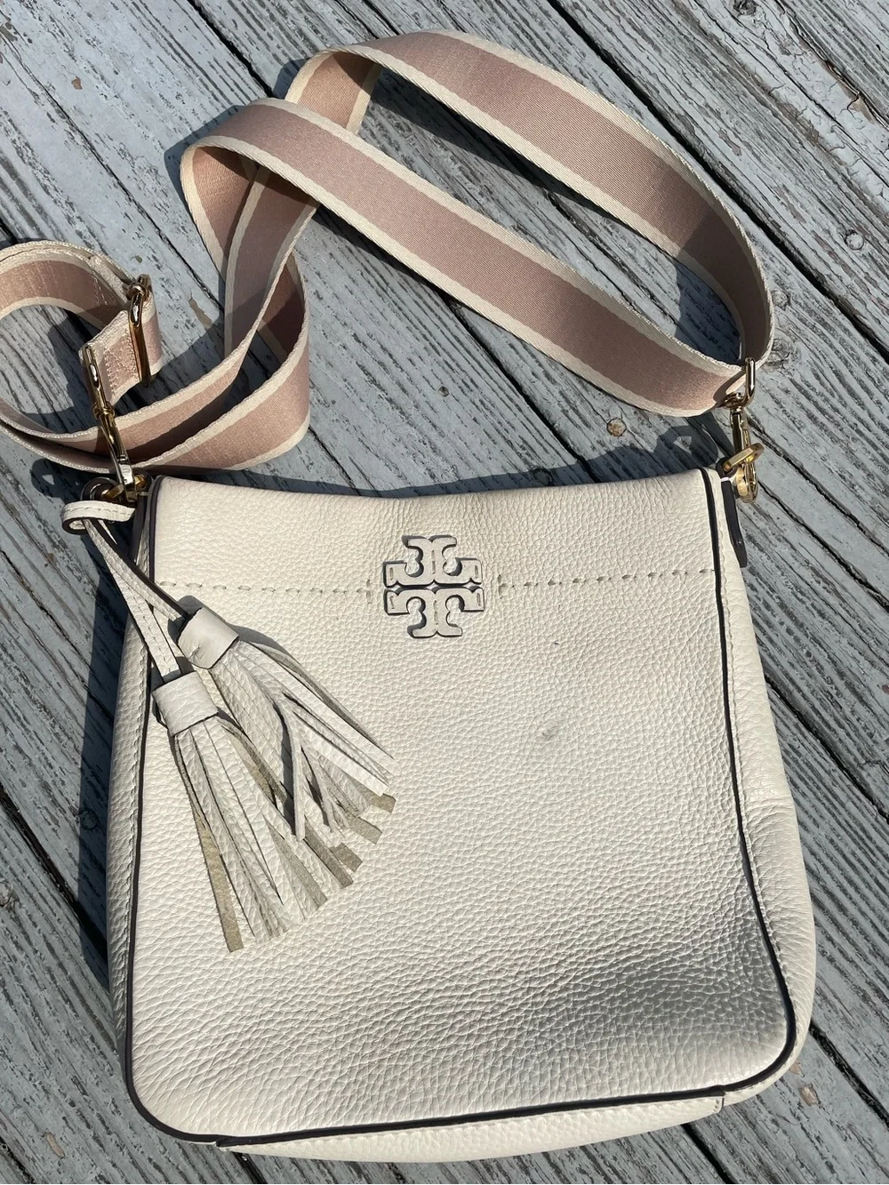 Tory Burch White Pebbled Leather Tassel Crossbody with Blush-Striped Strap: